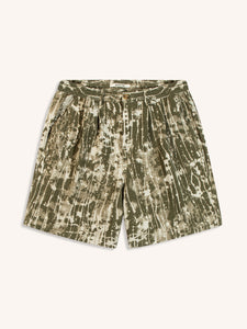 A pair of men's relaxed fit shorts in an abstract green camo print, on a white background.