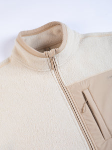 A cream coloured fleece jacket by KESTIN on a white background.