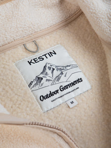 A KESTIN Outdoor Garments neck label on a men's cream colour fleece.