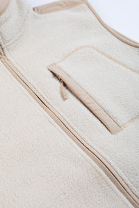 A cream colour fleece fabric on a men's vest/gilet.