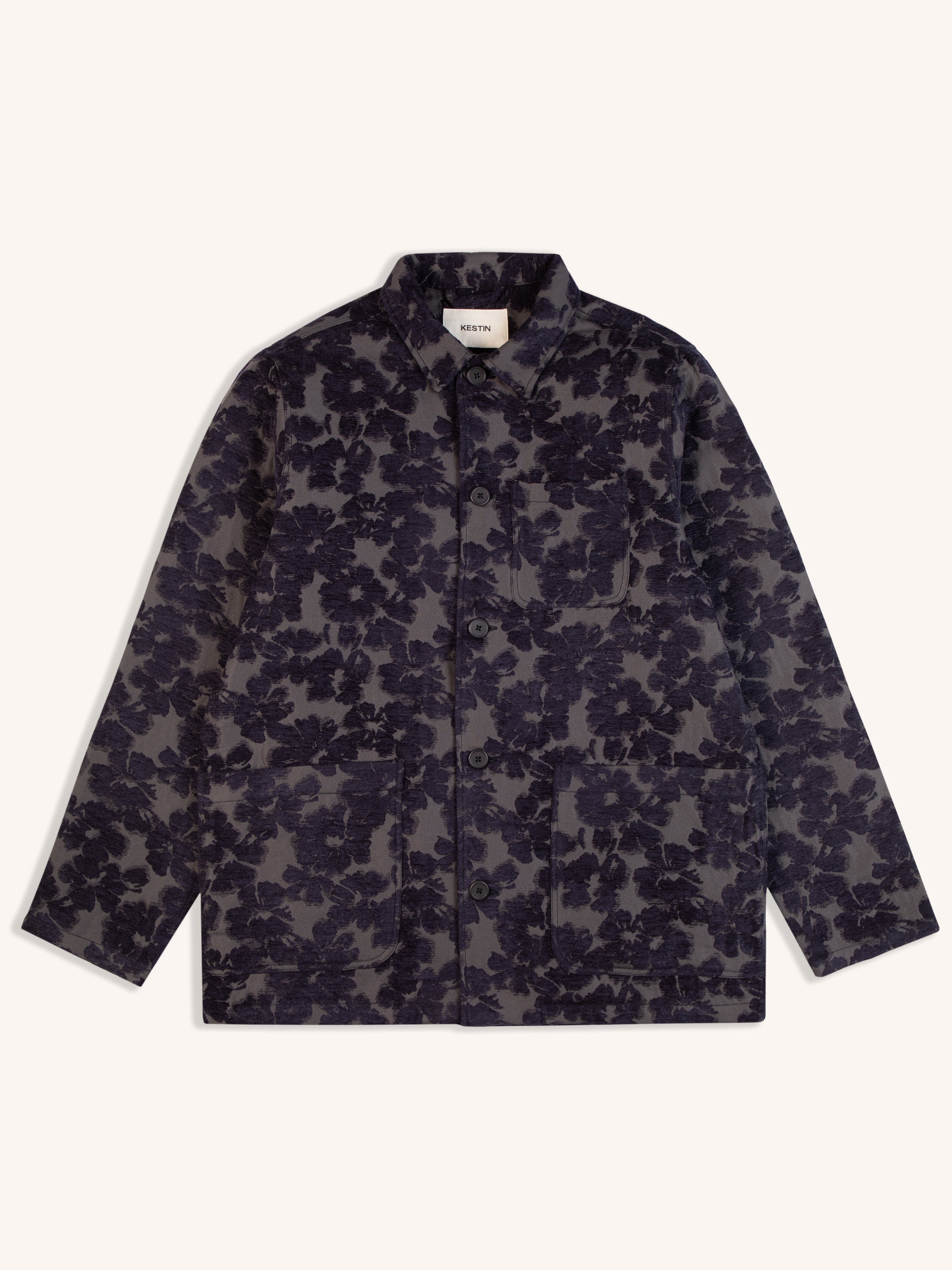A navy blue jacket from Scottish menswear designer KESTIN, made from a floral Japanese fabric.