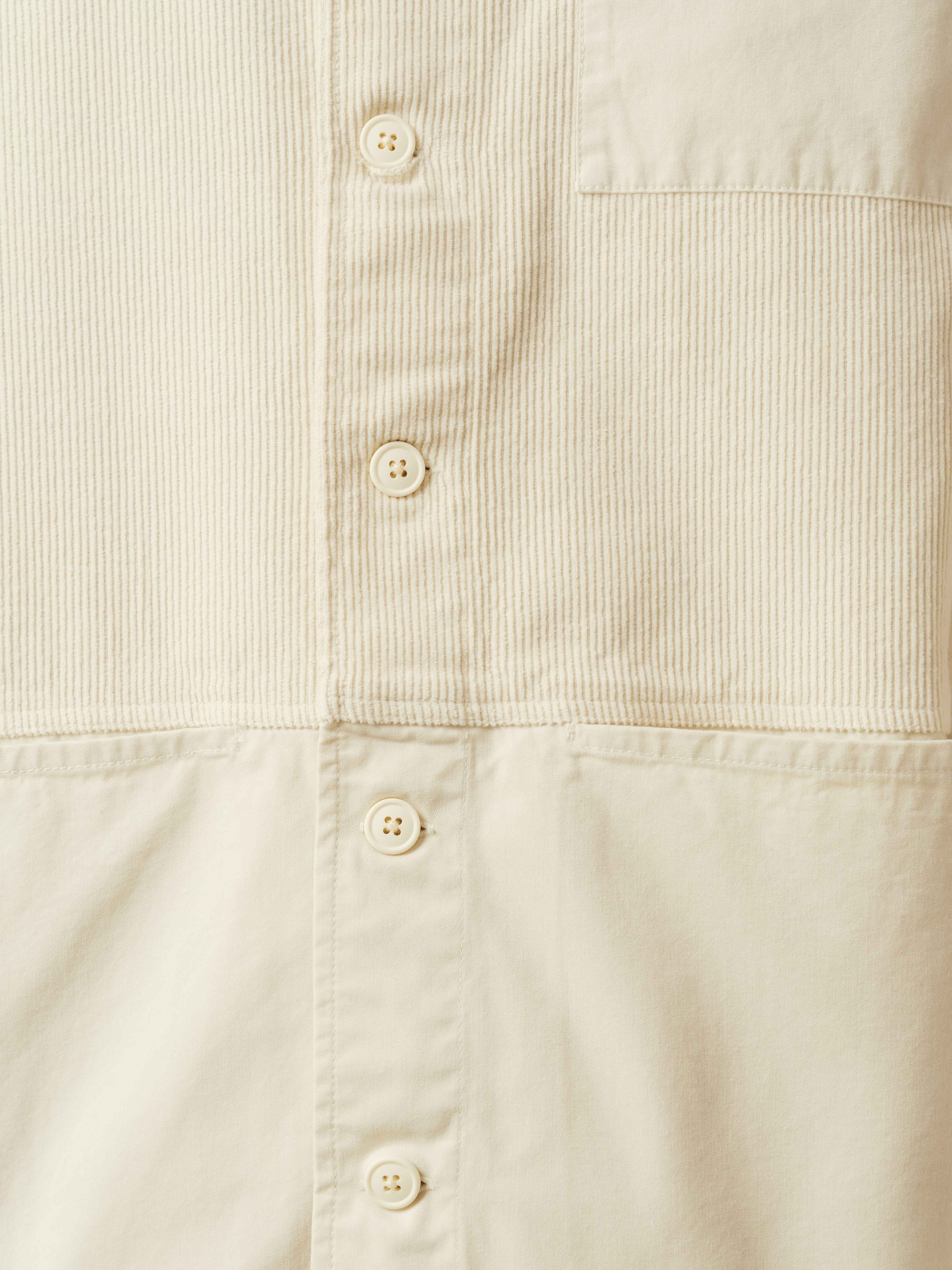 The buttoned front to the KESTIN Rosyth Overshirt in ecru.
