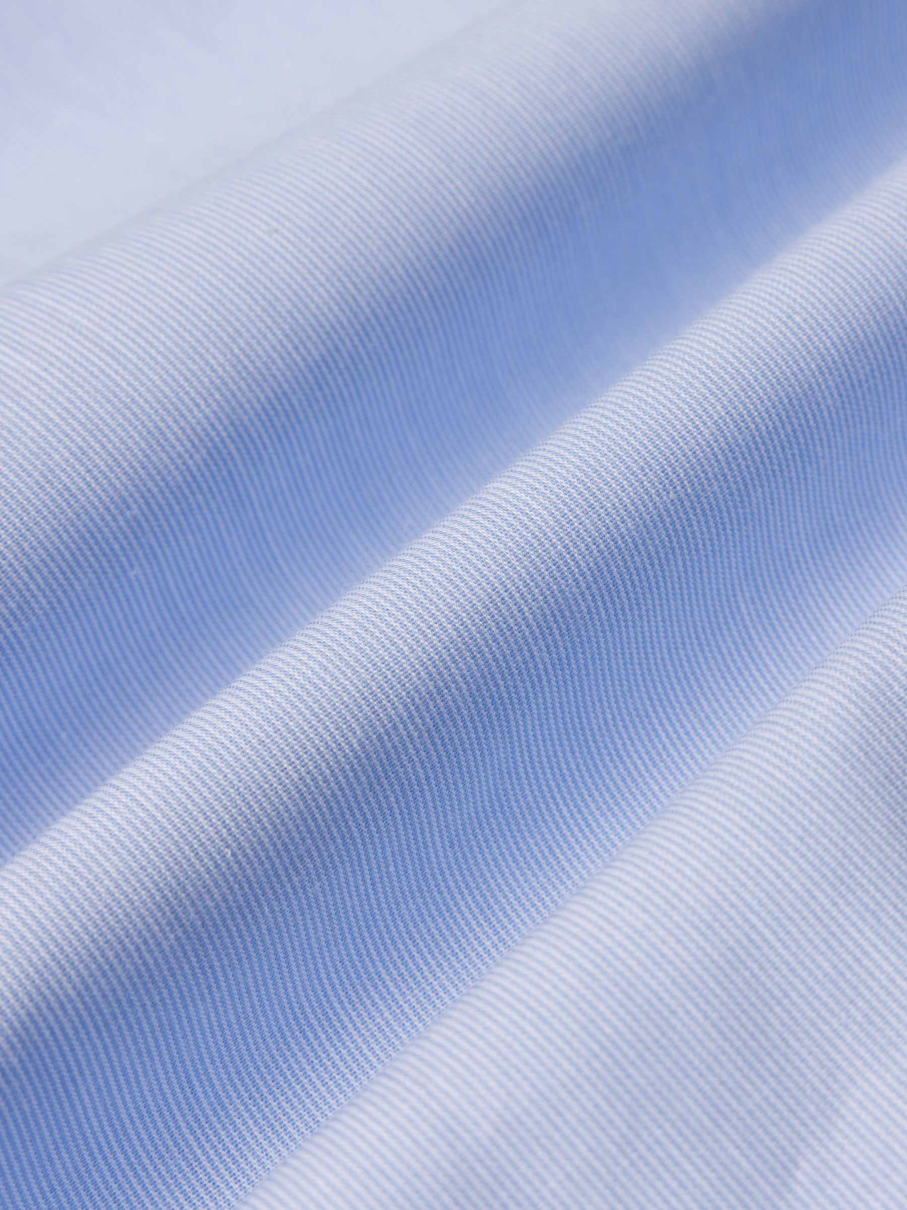 A lightweight blue and white stripe shirting material, used to make the KESTIN Dirleton Shirt.