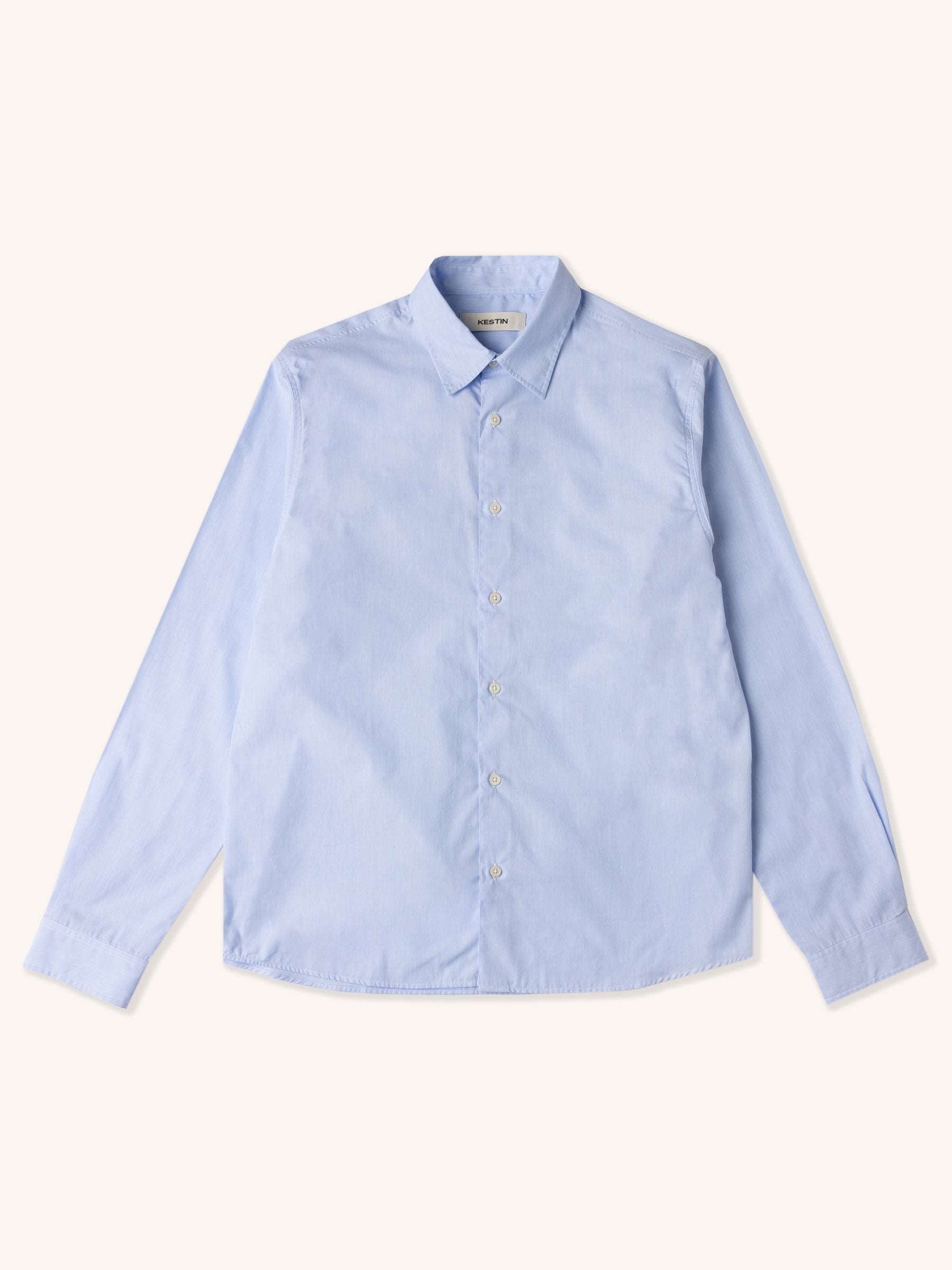 A lightweight, blue shirt from menswear brand KESTIN, on a white background.