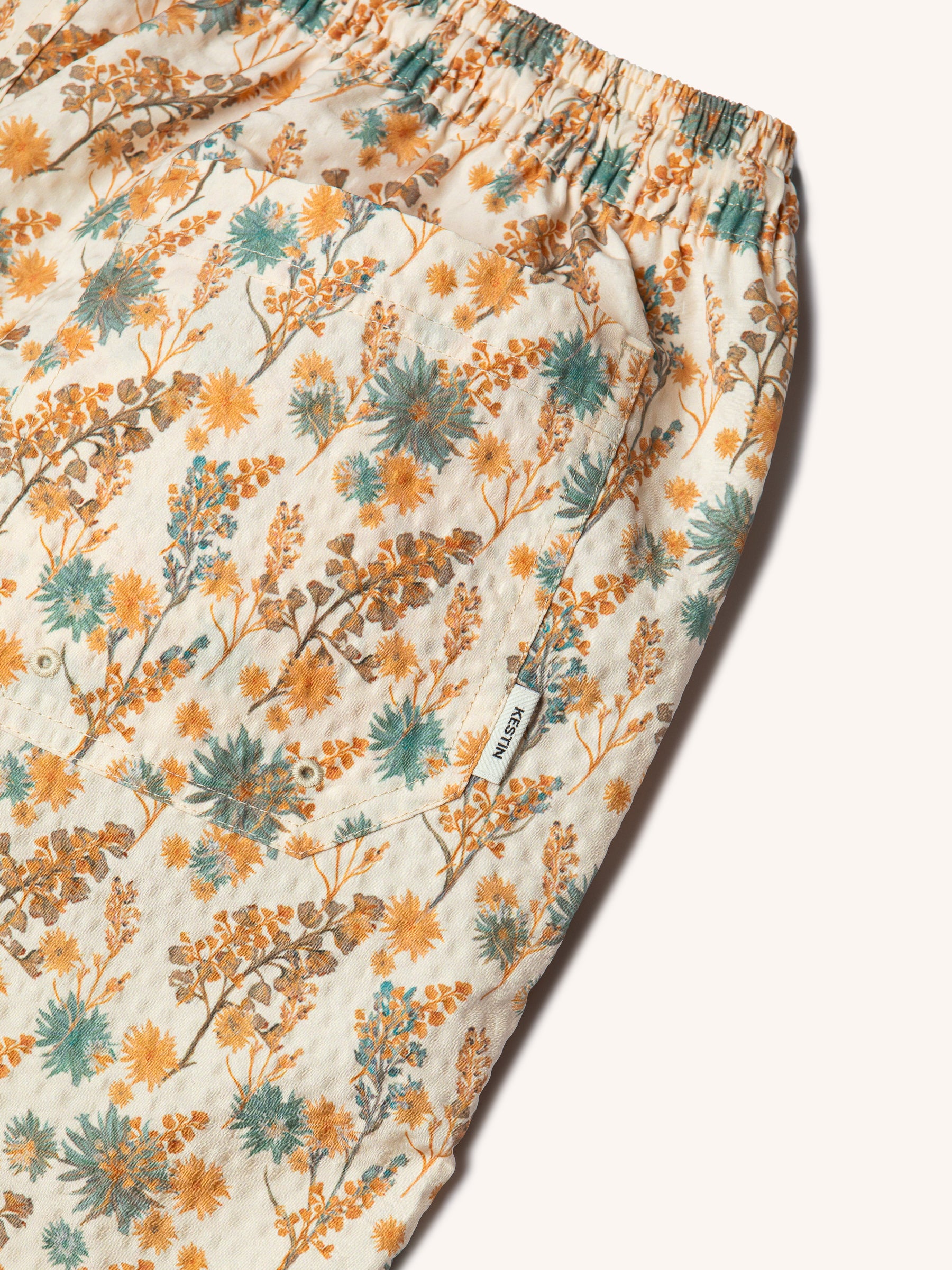 The logo tag and side of the KESTIN Seacliff Swimming Shorts.