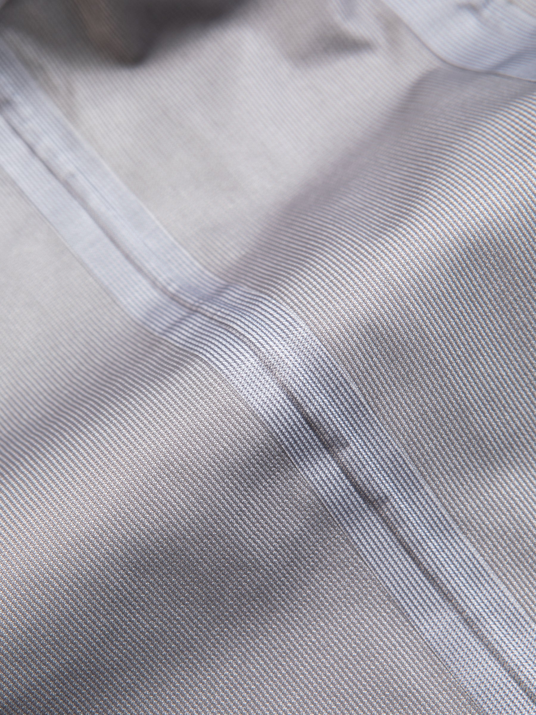 The technical inside fabric of a waterproof jacket, with a fully taped seam.