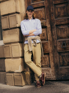 This model, leaning on a door in Edinburgh, wearing the Raeburn Button Down Shirt by premium menswear brand KESTIN, in a Light Blue colour.
