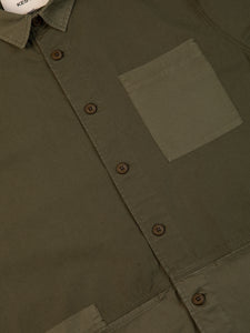 A close up of the front of the KESTIN Rosyth Overshirt in Dark Olive.