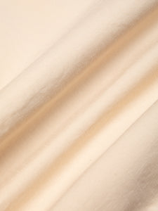 A close up of an ecru white cotton ripstop fabric, used by Scottish menswear designer KESTIN.