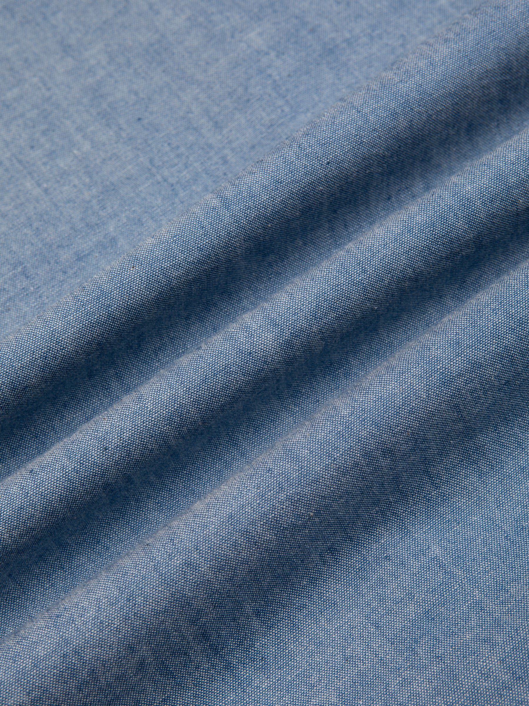 A premium Japanese cotton chambray material in blue, used by menswear brand KESTIN.