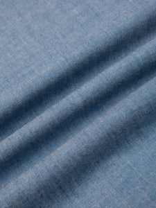 A premium Japanese cotton chambray material in blue, used by menswear brand KESTIN.