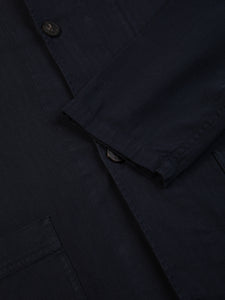 The front and cuff of the Huntly Jacket from KESTIN in Midnight Blue.