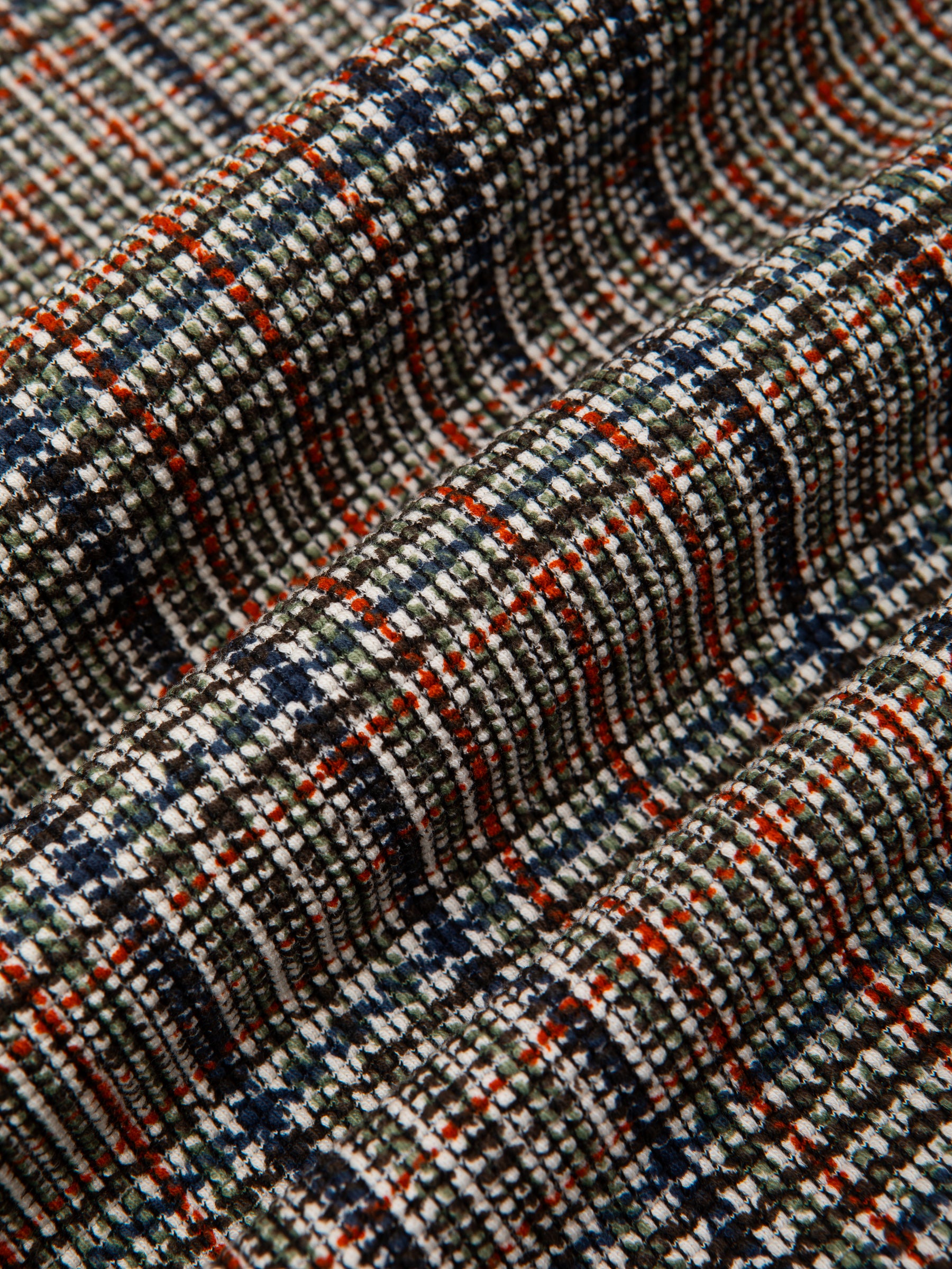 A printed olive green check pattern, used to make shirting by menswear brand KESTIN.