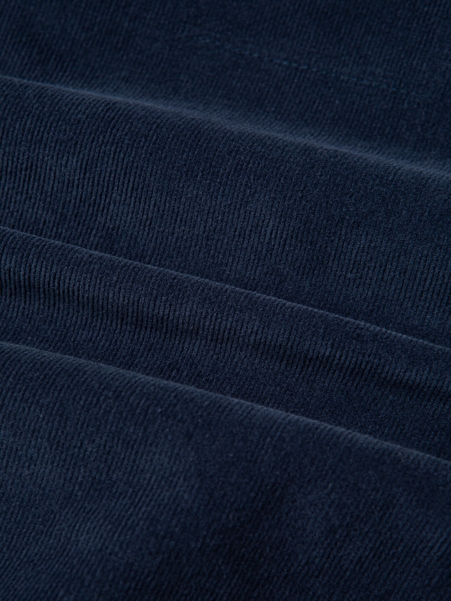 A lightweight washed navy corduroy fabric, used to make KESTIN Clyde Pants.