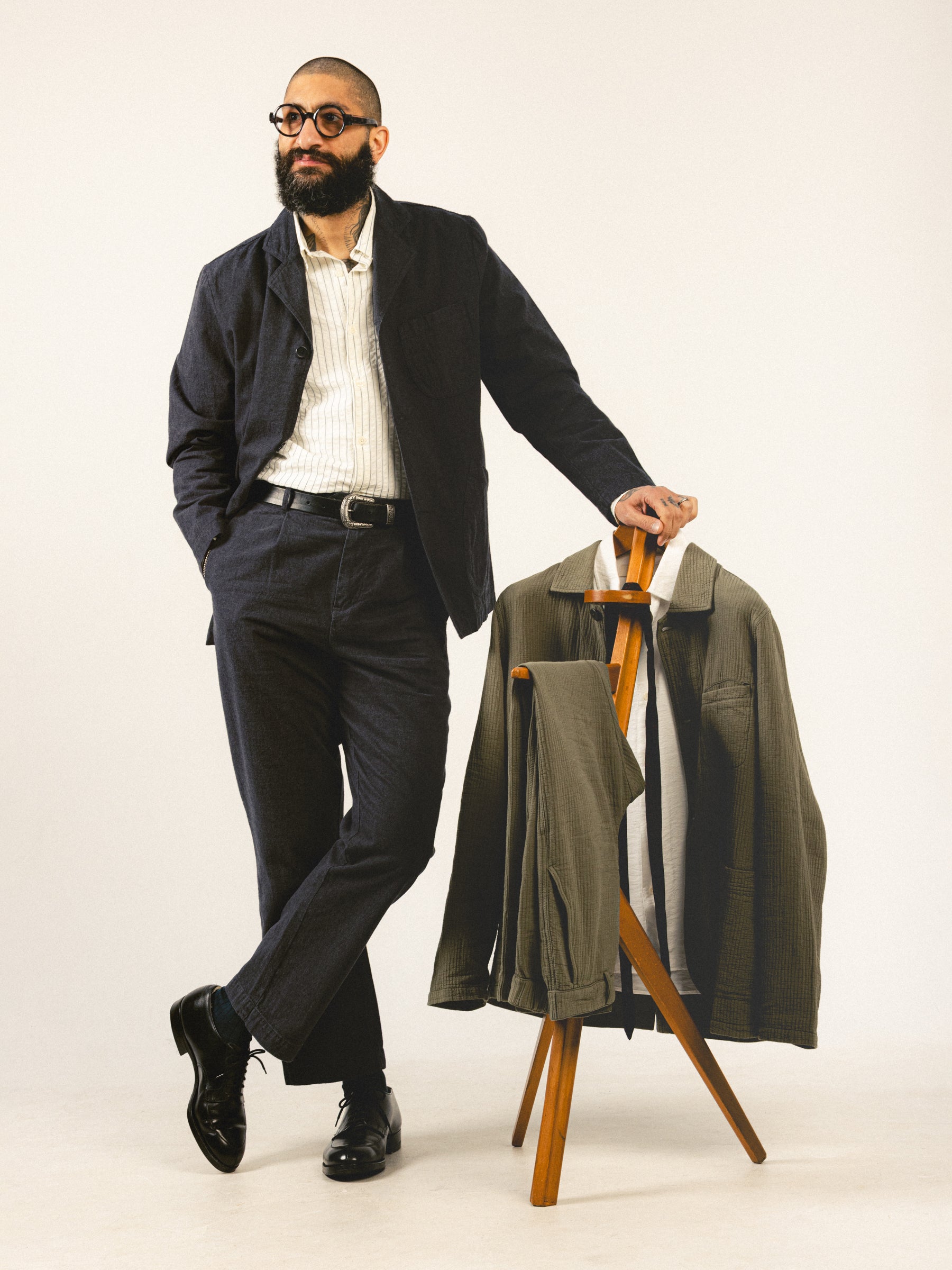 A model wearing a charcoal men's suit from Scottish designer label KESTIN.