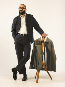 A model wearing a charcoal men's suit from Scottish designer label KESTIN.