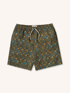 A pair of olive green swimming shorts with a floral pattern, from menswear brand KESTIN.