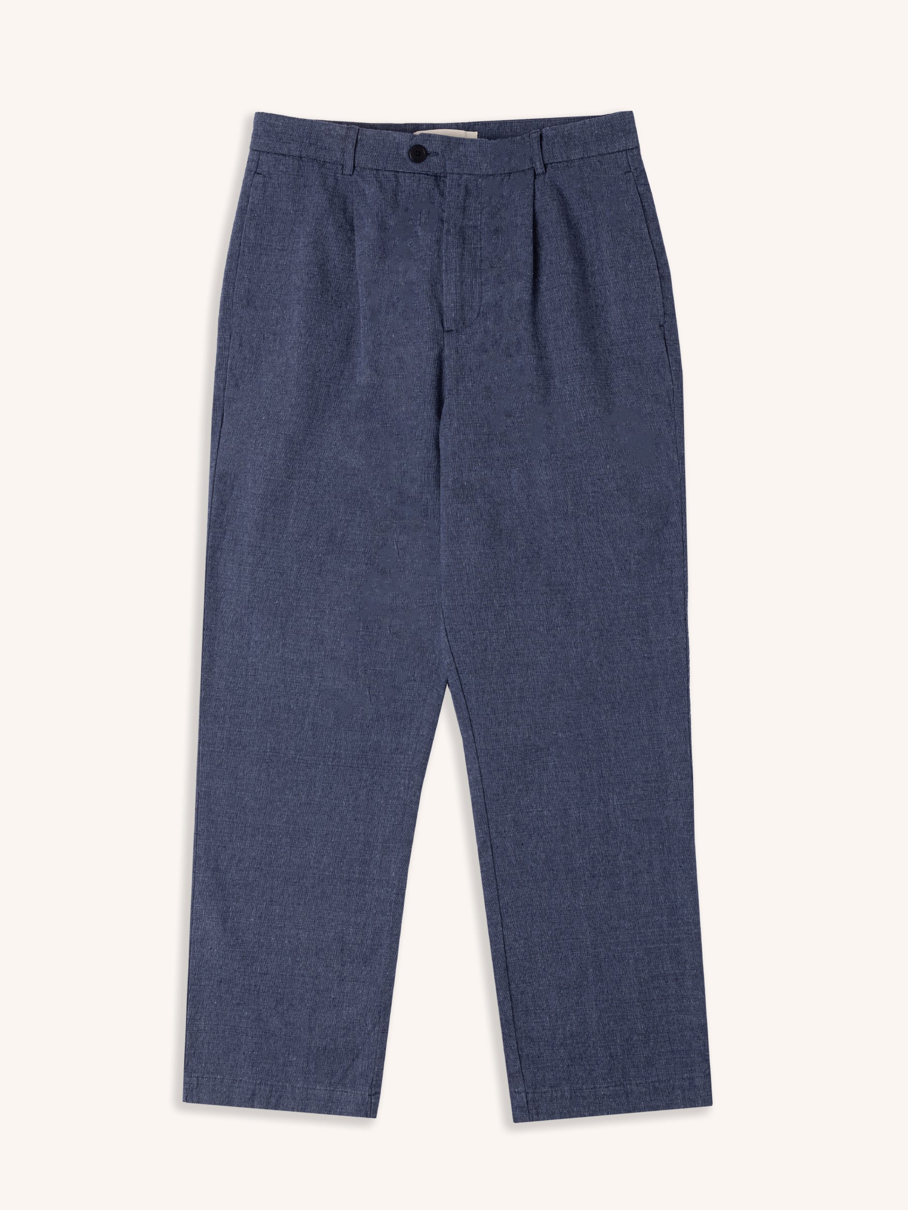 A pair of indigo blue suit trousers from menswear brand KESTIN, on a white background.