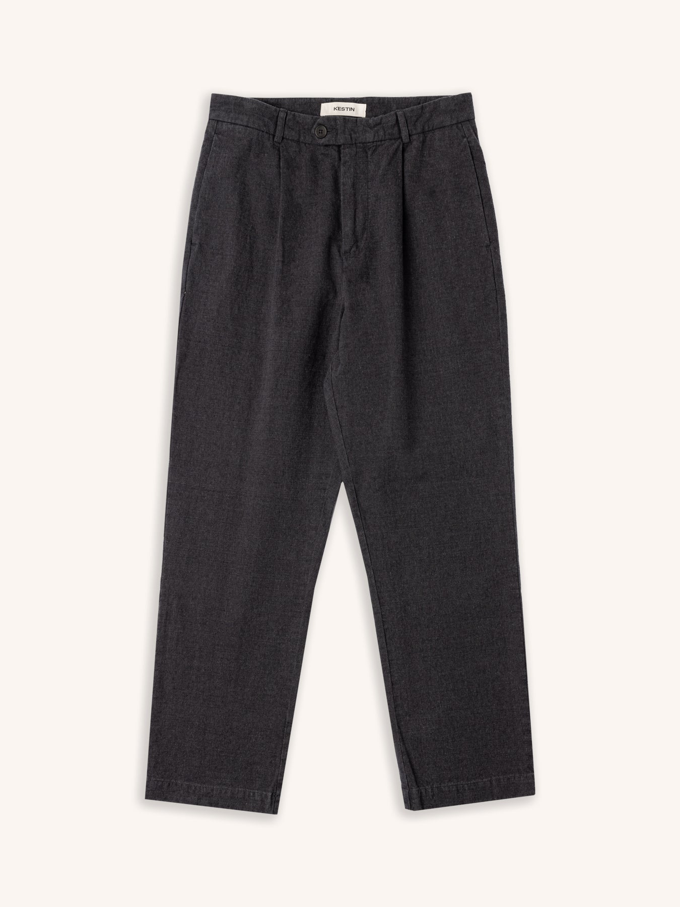 A pair of tapered fit suit pants from menswer brand KESTIN, on a white background.