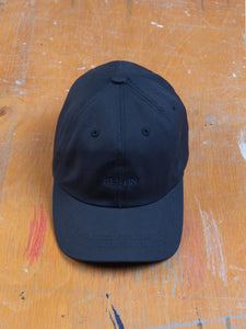 A six panel sports hat by designer menswear brand KESTIN, with an embroidered logo.