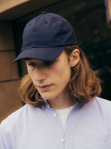 A model wearing a six panel cap by Scottish menswear designer KESTIN.
