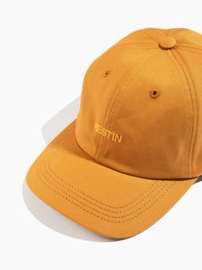 A six panel cap from Scottish menswear brand KESTIN with an embroidered logo to the front.