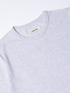 A close-up of the collar of the KESTIN Drem Tee in Grey Marl.