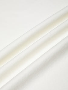 An ecru/off-white Better Cotton Initiative cloth, used to make the KESTIN Drem T Shirt.