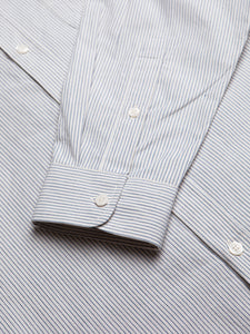 The buttoned cuff of the KESTIN Raeburn Shirt in a striped white Japanese fabric.