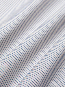 A white shirting material with thin blue stripes, from menswear brand KESTIN.