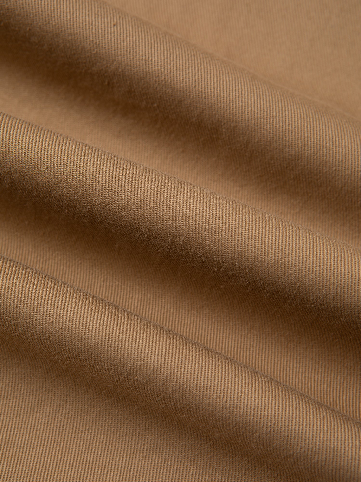A cotton twill fabric in a beige/khaki colour, used to make KESTIN Trousers.