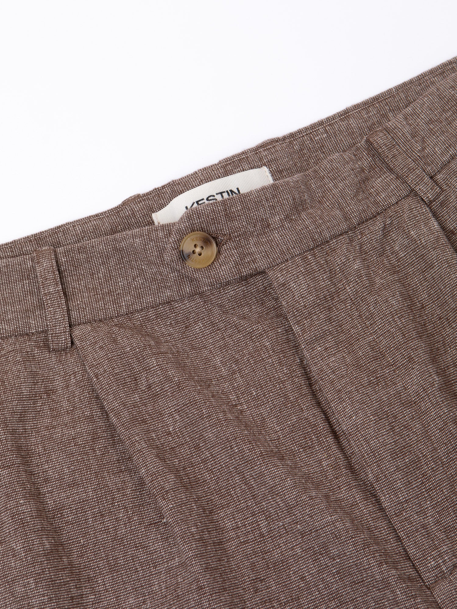 A close-up of the fixed waistband and fly of the KESTIN Wick Trouser.