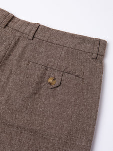 The buttoned rear pocket of the KESTIN Wick Suit Trouser in peat brown.