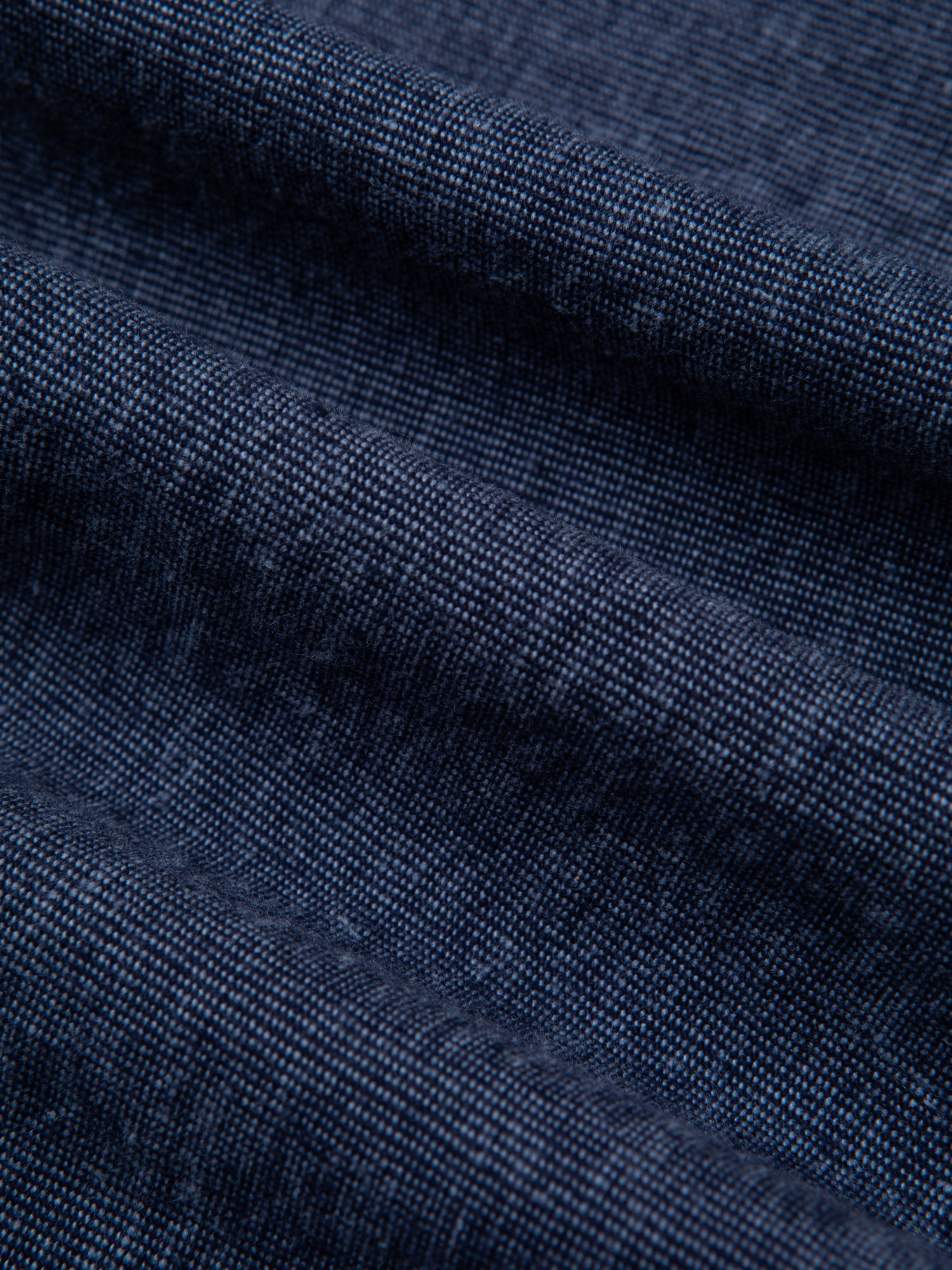 A blend of cotton and linen, dyed in Indigo, used to make clothing by menswear designer KESTIN.