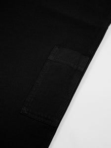 A patch painter pocket to the leg of the Aberlour Pants, in black cotton canvas.