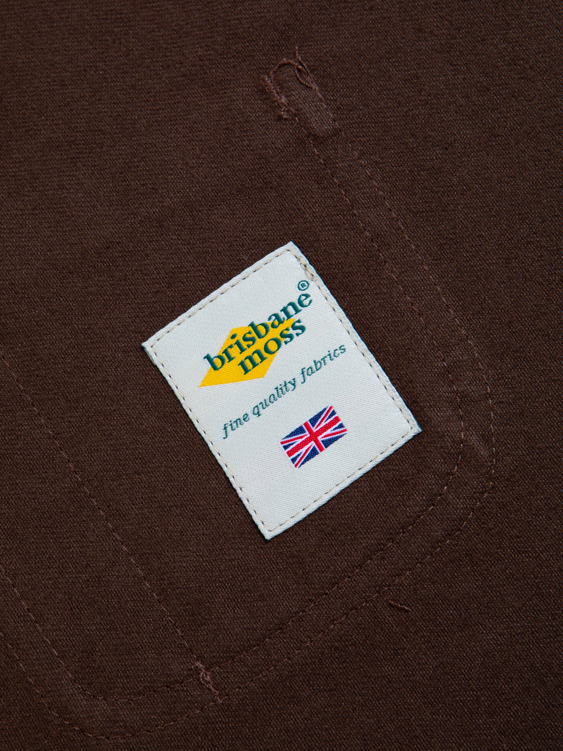 A woven logo patch to the inside of the Neist Apron by KESTIN.