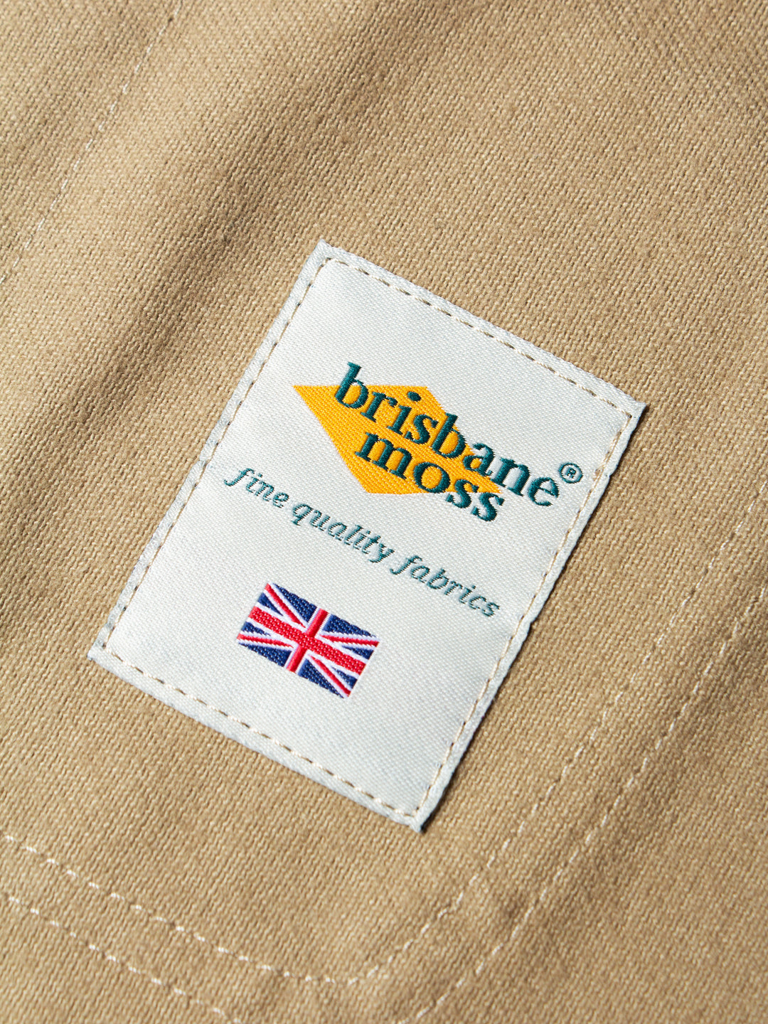 A woven logo patch showing the quality UK-made fabric used for the KESTIN Neist Apron.