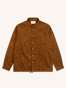 A coach jacket from Scottish designer KESTIN, in a brown paisley print pattern.