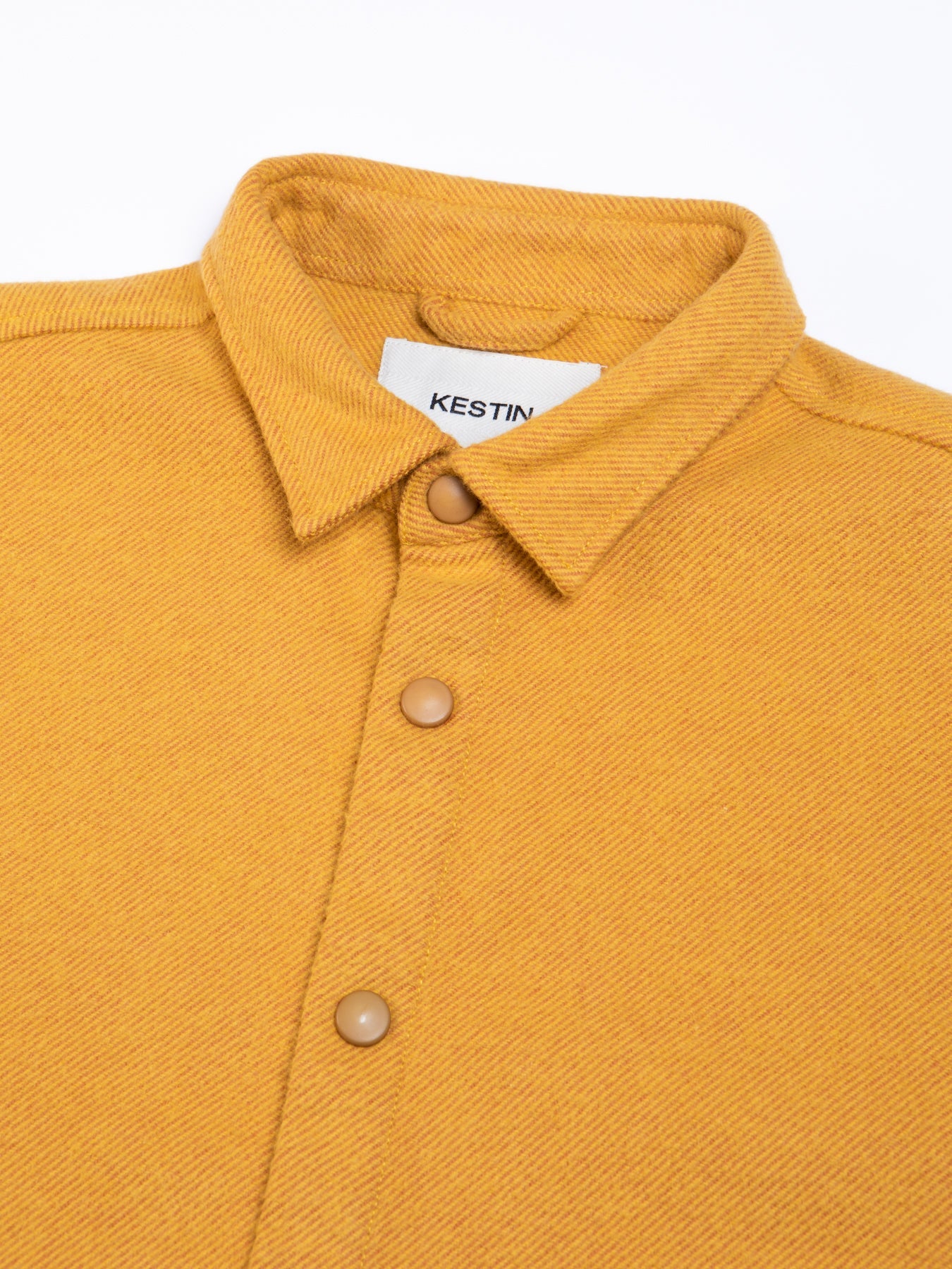 A close-up of the collar and snap-up front, on the Armadale Shirt by KESTIN.