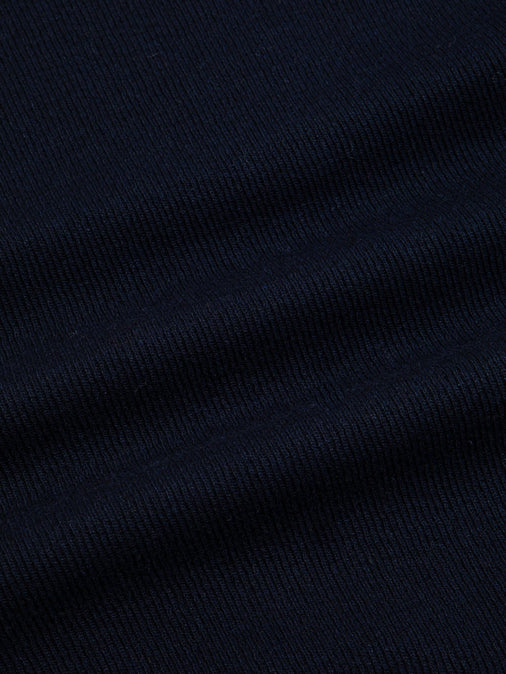 A navy blue knitted fabric, made from recycled Japanese wool.