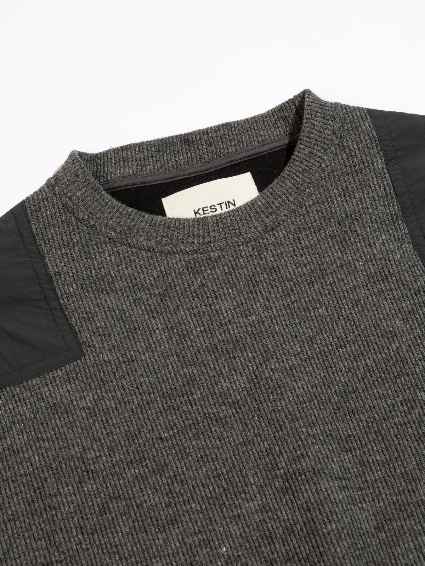 A ribbed crew neck and shoulder panels, on a premium knitted sweater by menswear designer KESTIN.