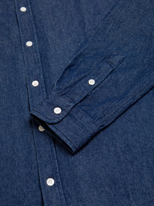 A shirt cuff, folded over the front of the shirt, which is made from a comfortable 100% cotton denim.