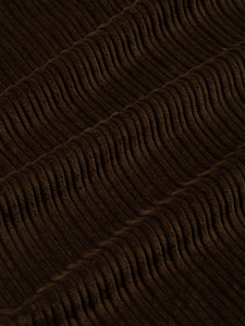 An irregular corduroy fabric in dark brown, used to create the Wick Trousers from KESTIN.