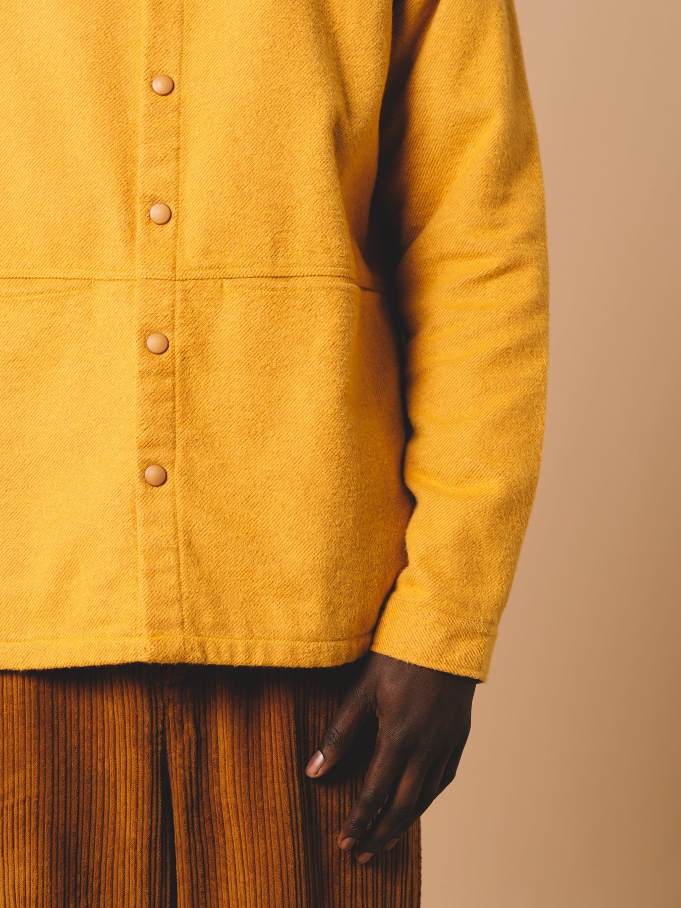 A close-up of the Armadale Overshirt from KESTIN, made from a yellow brushed cotton.