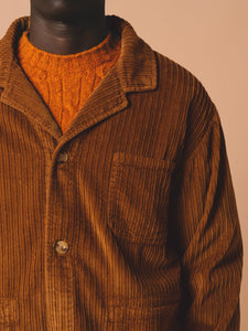A close up of a men's fall suit, with the KESTIN Port Jacket and Made In Scotland Knitwear.