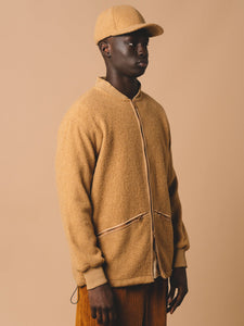 The side profile of KESTIN's Dreghorn Fleece, made from a warm wool blend.