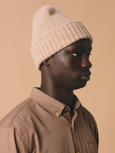 A KESTIN Beanie, knitted in Scotland from premium wool, worn with the Raeburn Button Down Shirt.