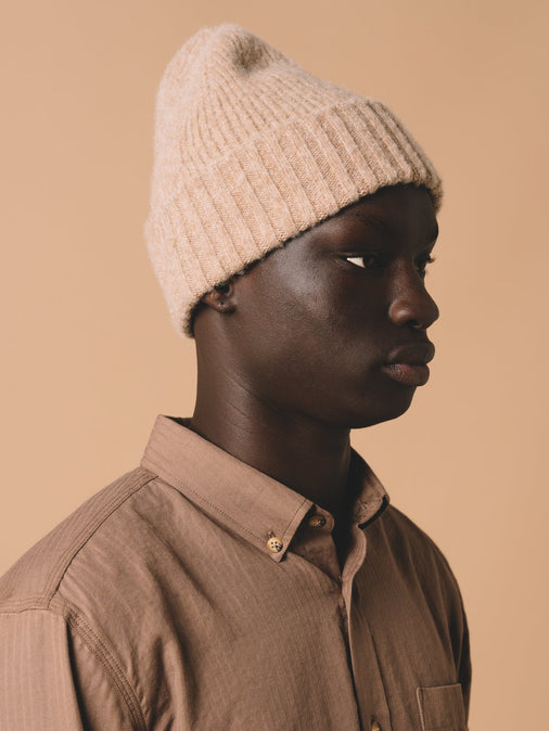 A knitted lambswool beanie from designer menswear brand KESTIN, made in Scotland.
