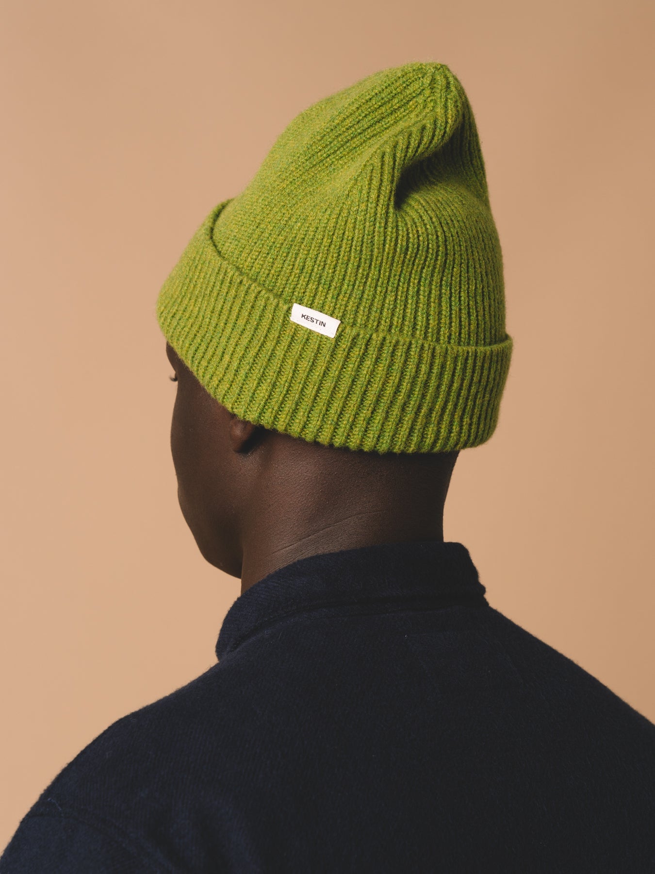 A men's lambswool beanie, made in Scotland by menswear designer KESTIN, in green.