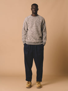 A model wearing relaxed fit jeans and an Italian wool fleece in grey, by men's brand KESTIN.